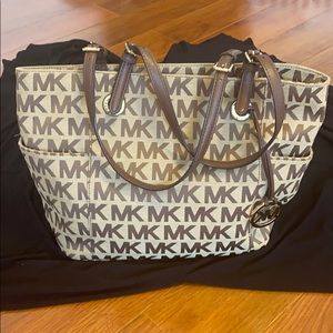 Michael Kors monogram over the shoulder bag.